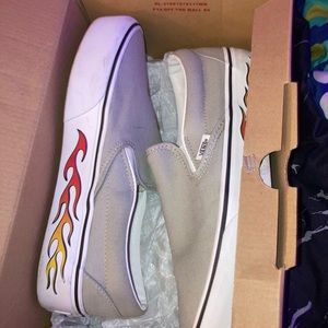 Grey Classic Slip on Vans with sidewall flames.